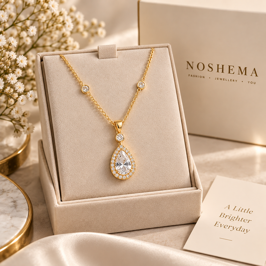 Aurelia Pendant Necklace by Noshema — elegant gold pear-shaped pendant necklace with sparkling clear stones