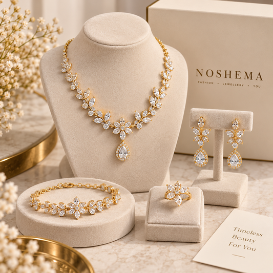 Amara Jewellery Set by Noshema — gold-tone necklace, earrings, bracelet and ring with crystal floral details